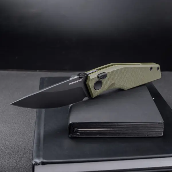 Real Steel RSK Spectrum PVD black / OD Green G10 Nitro-V Stahl Button Lock